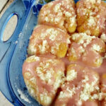 Close up of Raspberry Lemon Pull Apart Rolls in a blue baking dish.