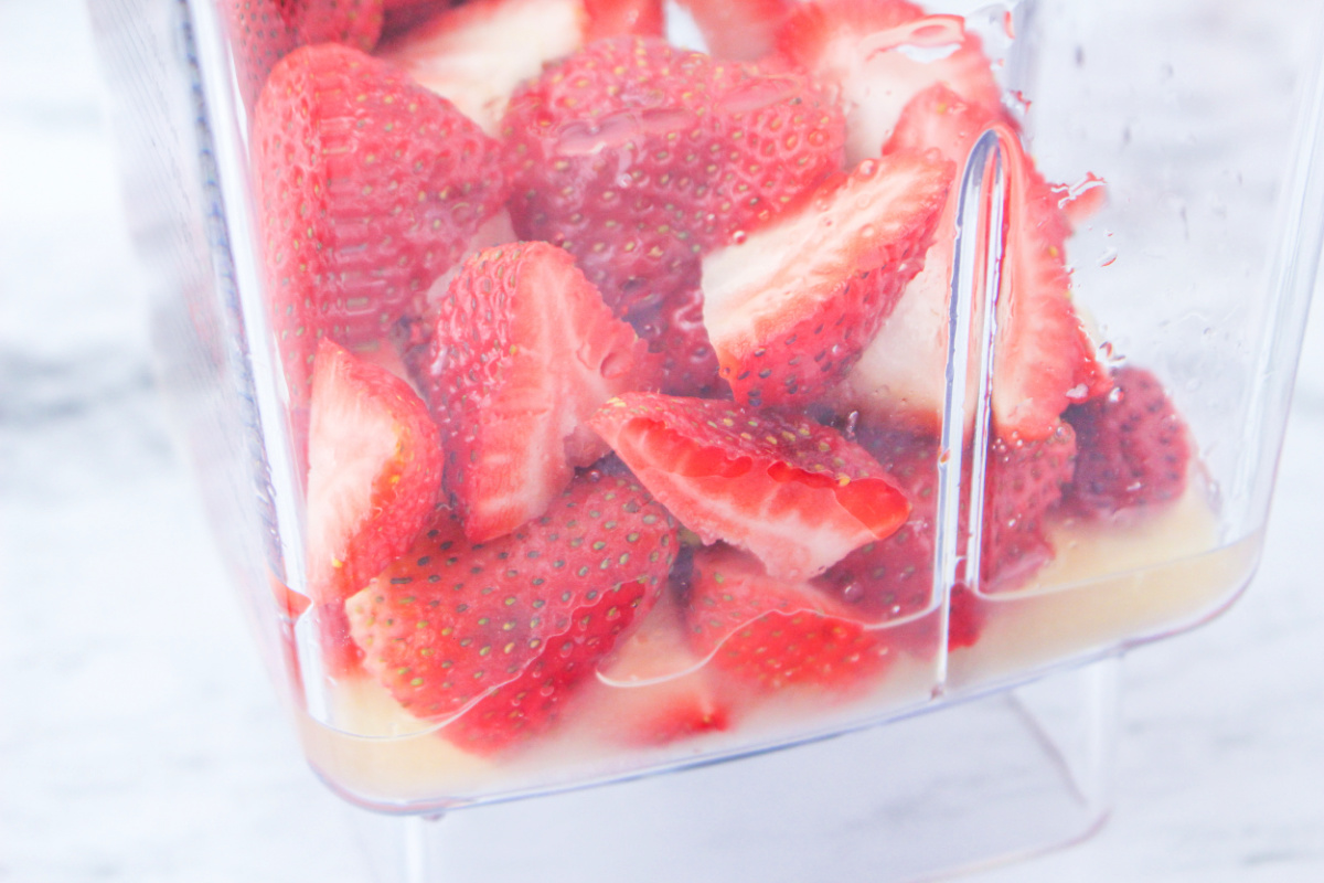How to Make Strawberry Tea - close up of strawberries in a blender.