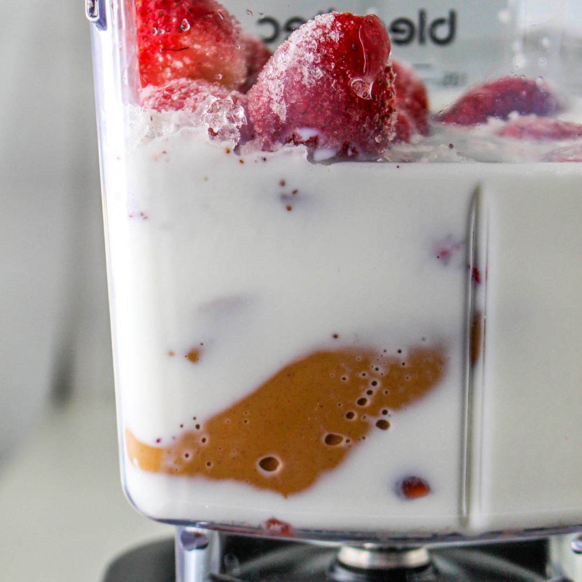How to Make a Peanut Butter and Jelly Smoothie - ingredients in a blender.