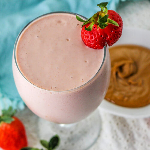PB and J Smoothie garnished with a strawberry.