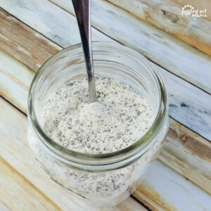 Homemade Ranch Seasoning in a mason jar with a spoon.