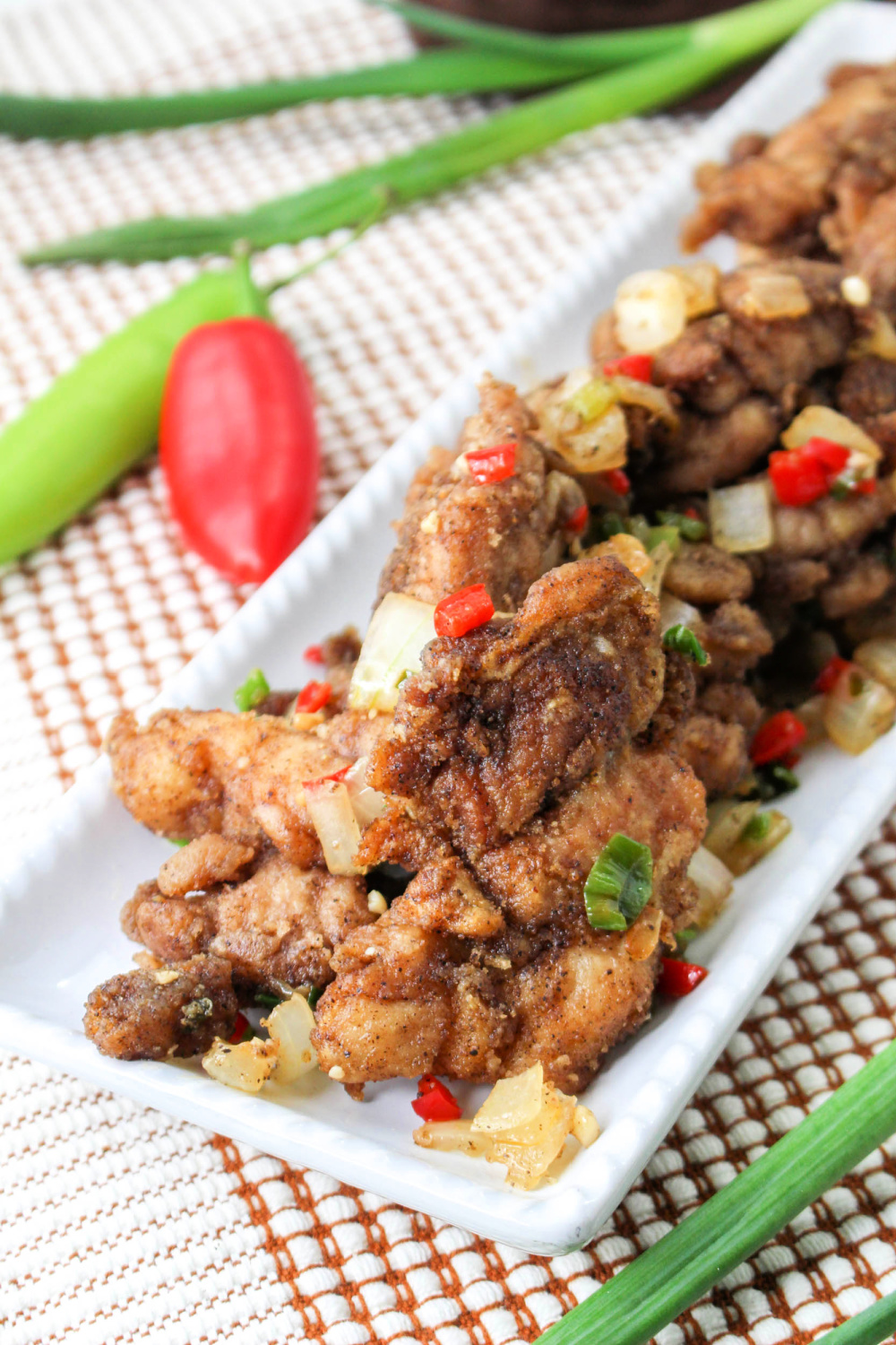 Crispy Chicken on a long white platter.