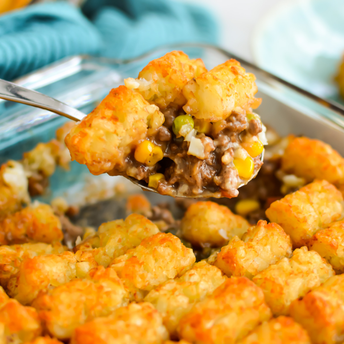 Close up of serving spoon with Sheperd's Pie Tater Tots Casserole.