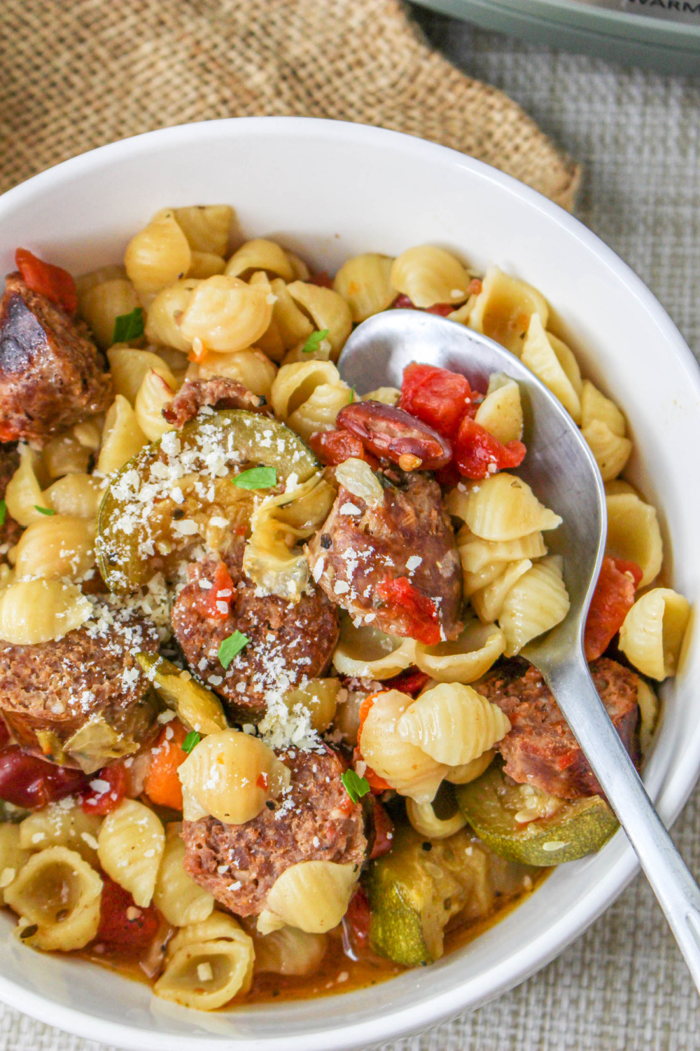 Slow Cooker Sausage Stew in a bowl with a spoon.