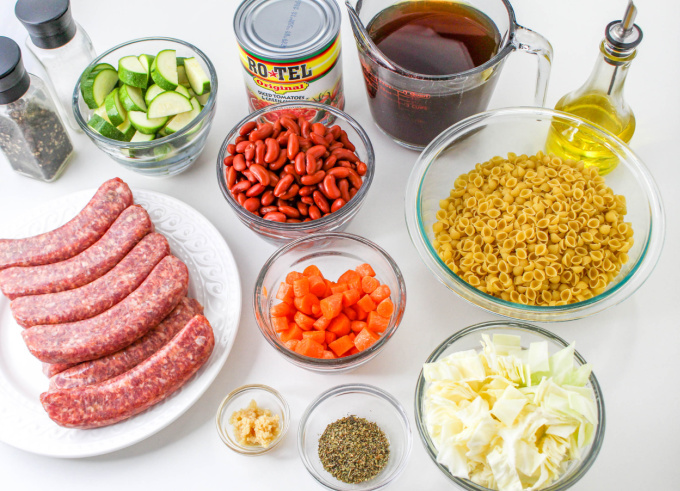 Slow Cooker Sausage Stew Ingredients on a countertop.