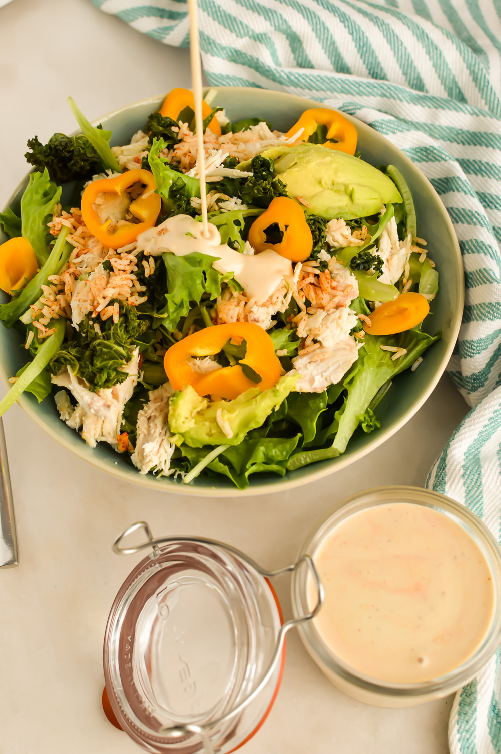 Southwest Salad Dressing drizzling onto a salad.