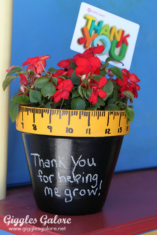 Painted pot with a plant for teachers.