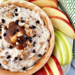 Apple Toffee Dip in a small bowl surrounded by pear and apple slices.