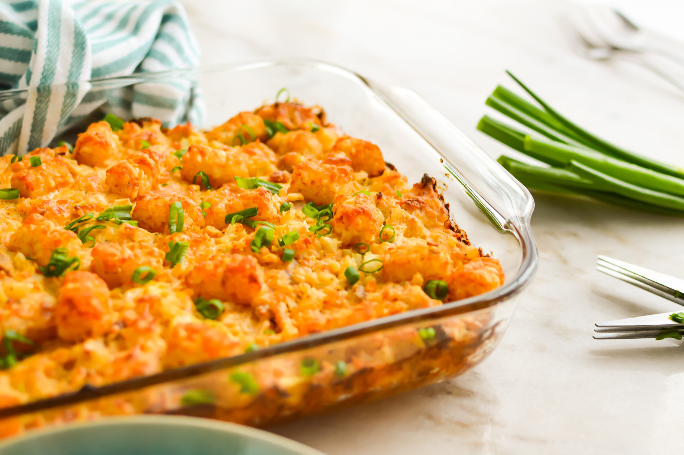 Buffalo chicken tot casserole in a baking dish.