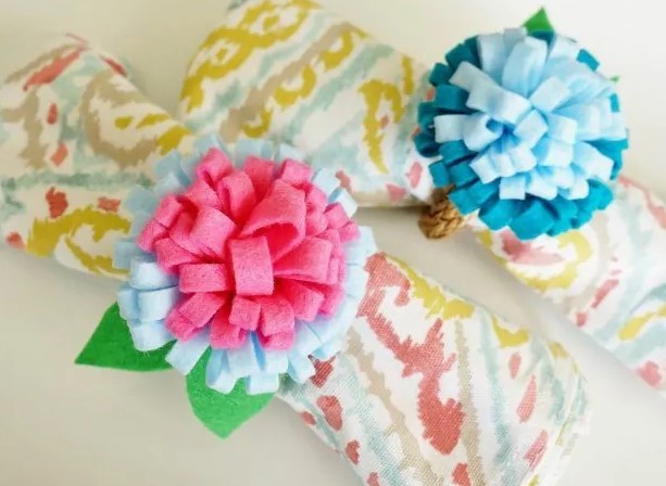 Felt flowers on napkins.