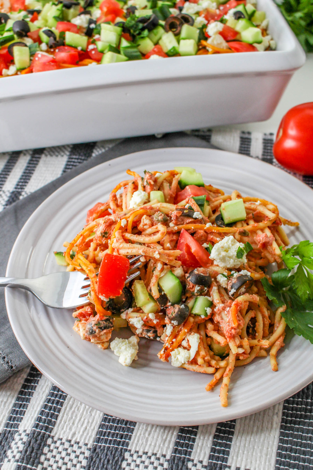 Greek Spaghetti Casserole on a plate with a fork.