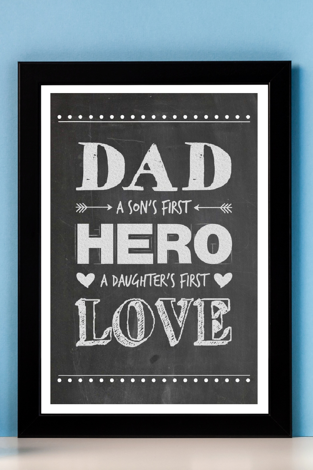 Framed Hero Dad Father's Day Printable and plants on a shelf.