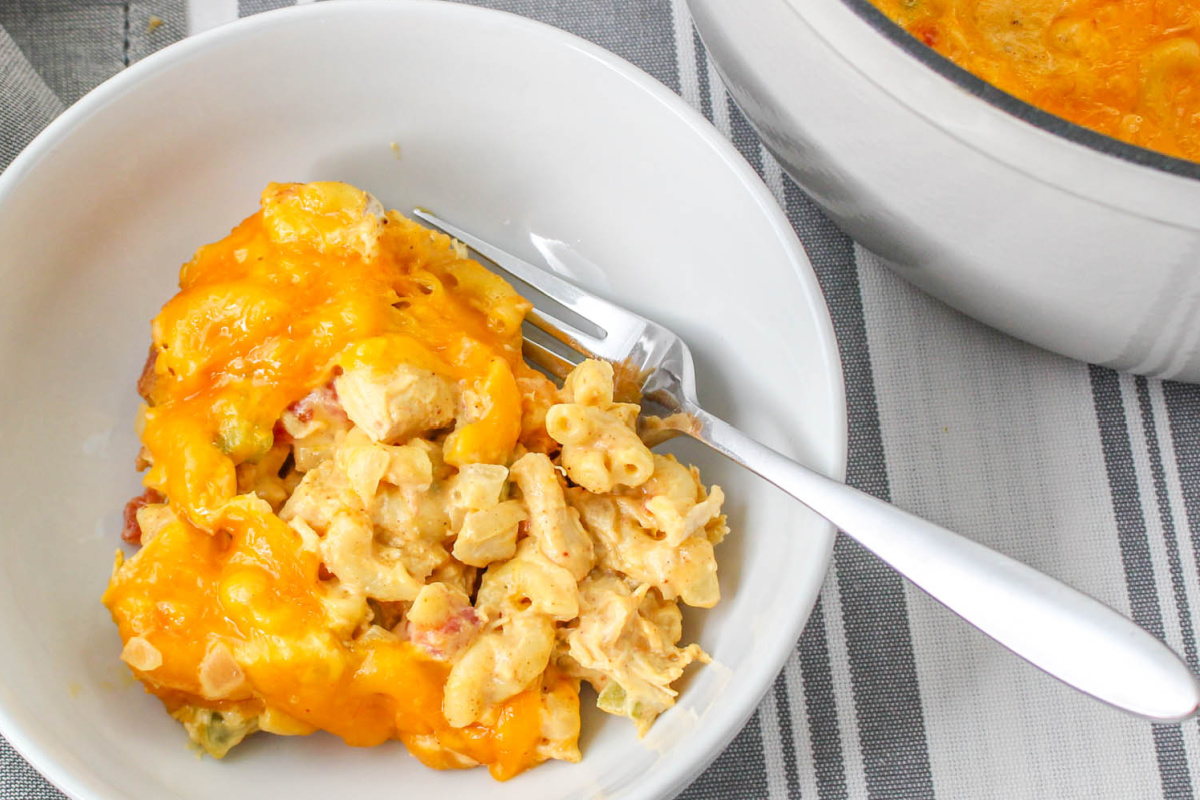 King Ranch Chicken Mac and Cheese in a bowl with a fork.