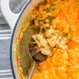 Close up of Ranch Mac and Cheese in a baking dish with a serving spoon.