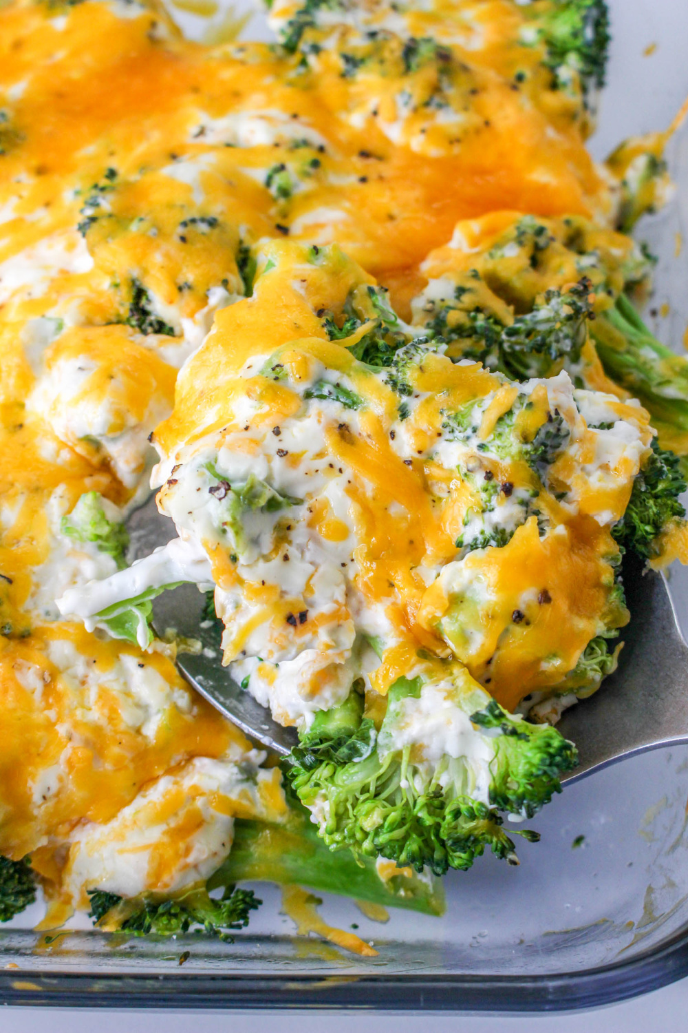 Cheesy Broccoli side dish in a casserole dish.
