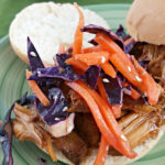 Close up of Slow Cooker Pulled Pork Sliders with Asian Purple Cabbage slow.