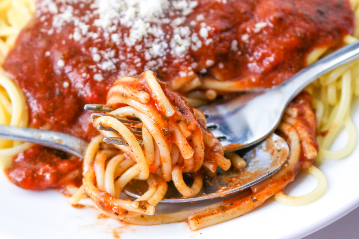 Close up of Spaghetti with Tomato Sauce and Spaghetti Sauce Seasoning.
