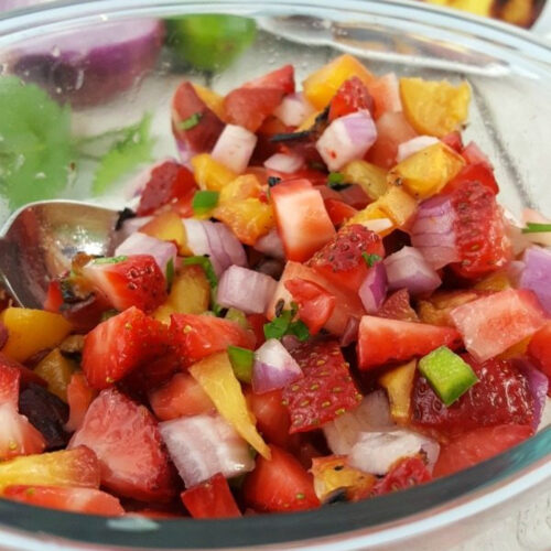 Strawberry Peach Salsa with red onions and jalapeno in a bowl.