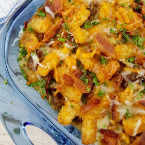Close up of Tater Tot Breakfast Casserole with cheese and bacon.