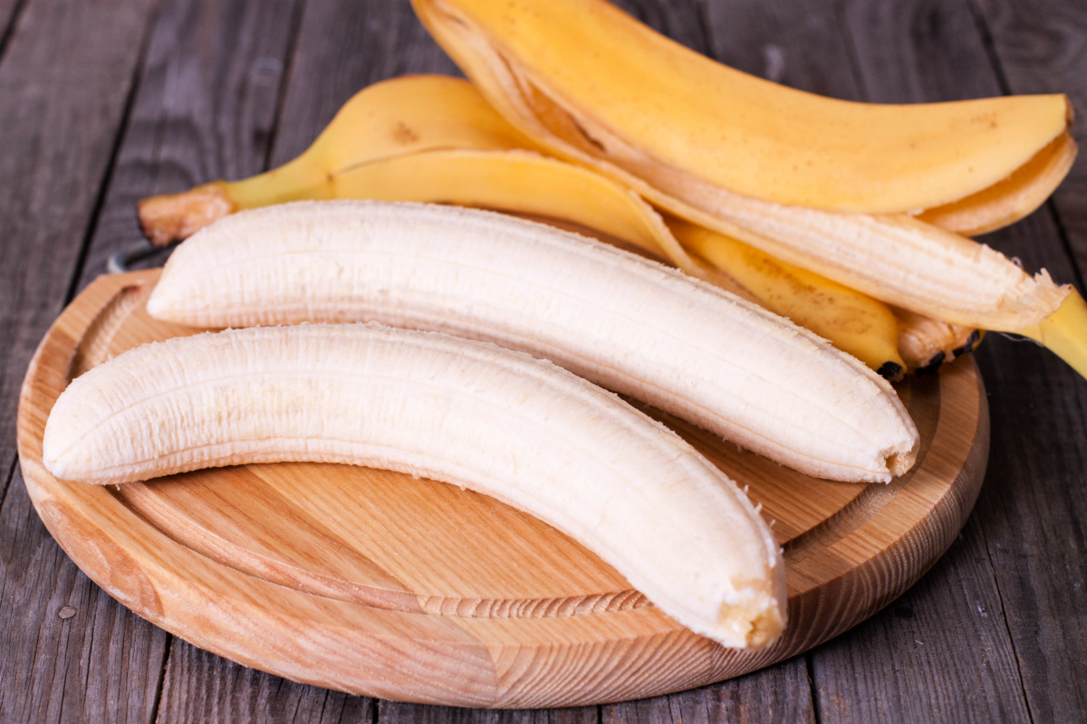 Peeled bananas cutting board.