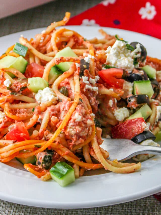 Greek Spaghetti Bake on a plate with a fork.