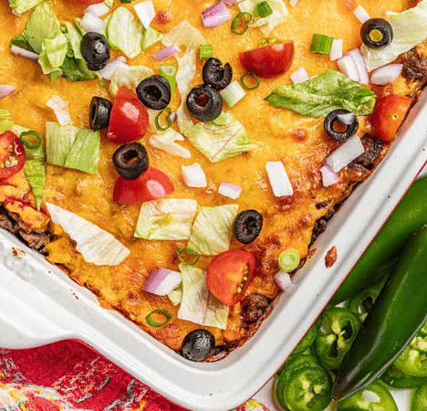 Top down view of taco casserole with fresh taco toppings.