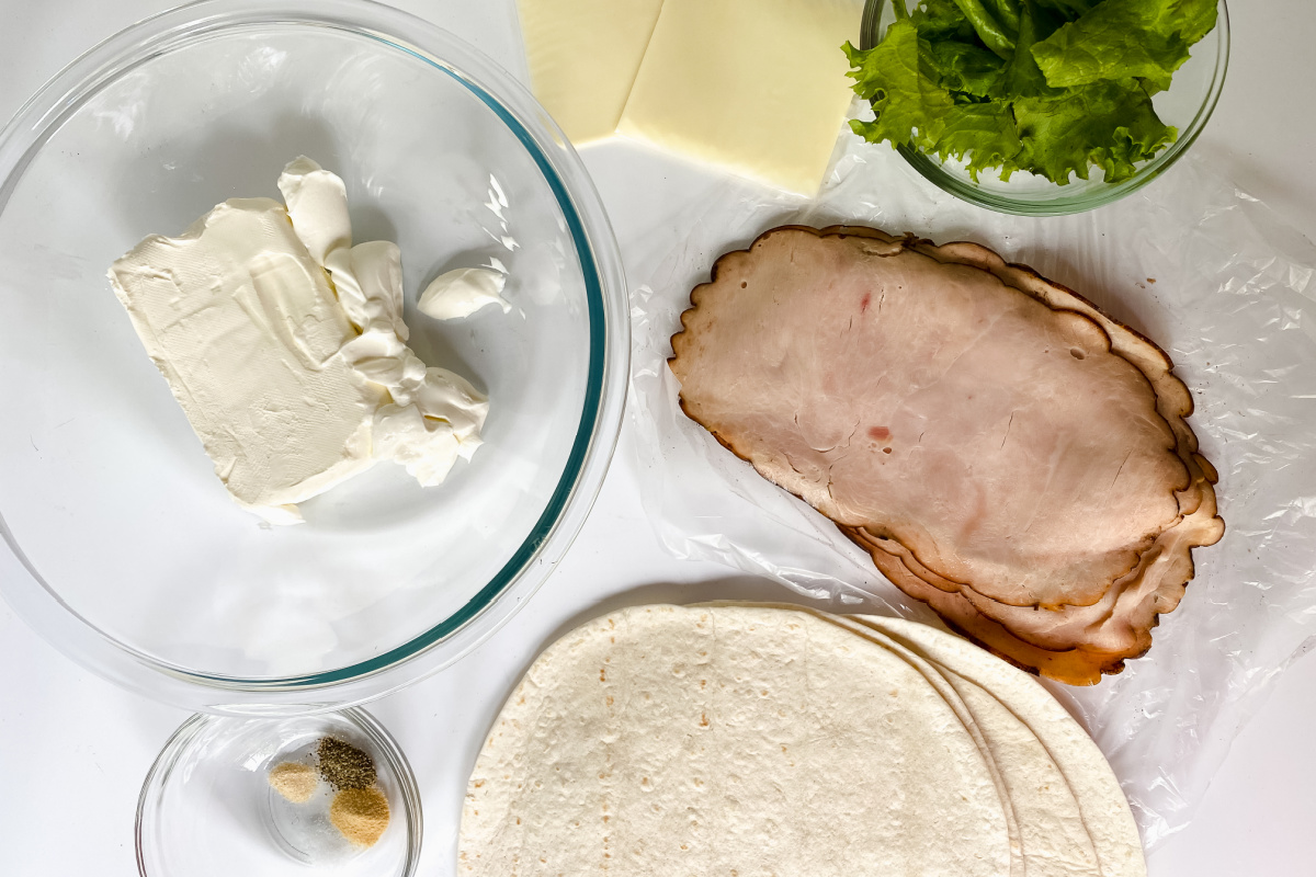 Turkey pinwheel ingredients on a countertop.