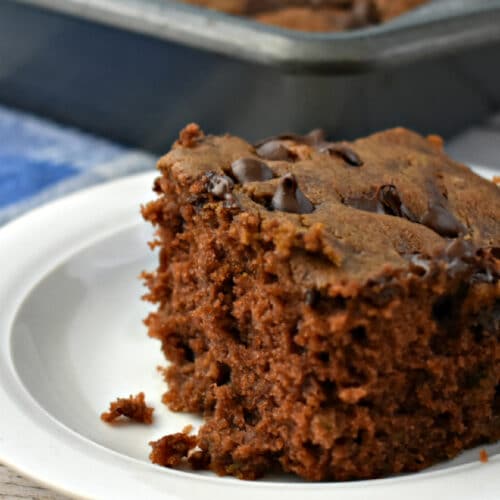 Piece of Chocolate Zucchini Cake on a plate.