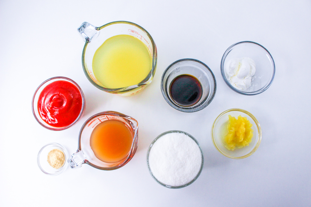 Pineapple Sweet and Sour Sauce Ingredients in bowls and measuring cups.