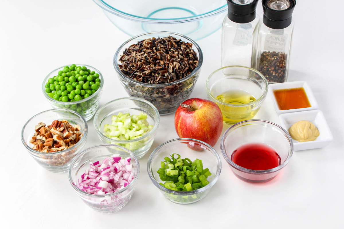 Wild Rice Salad Ingredients in bowls on a counter.