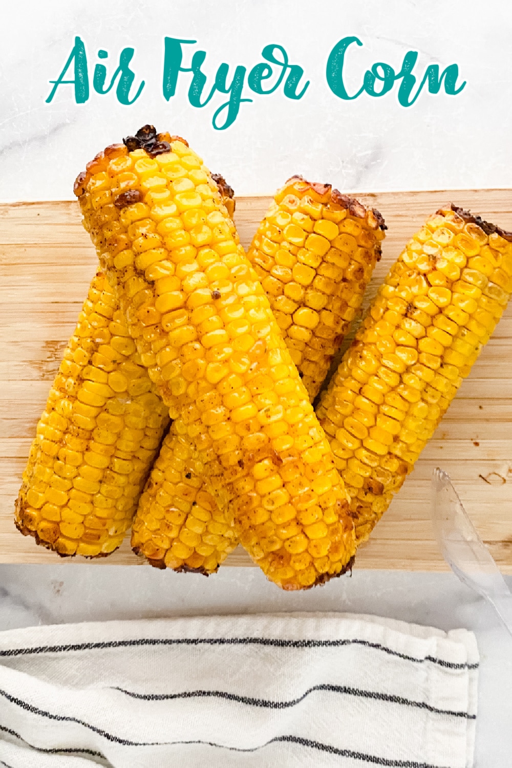 Air Fryer Corn on a cutting board.