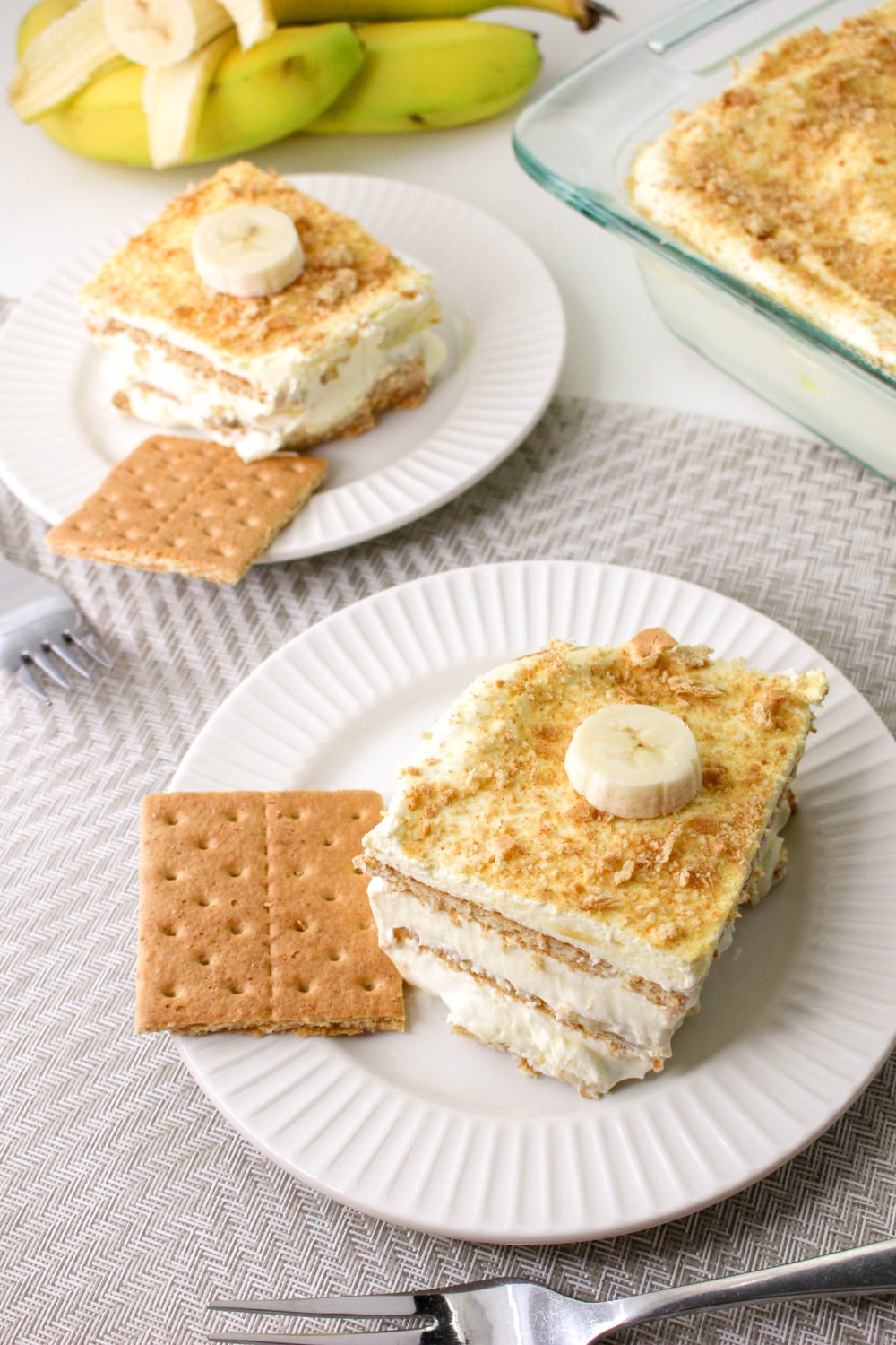 Slices of Banana Pudding Ice Box Cake on plates.