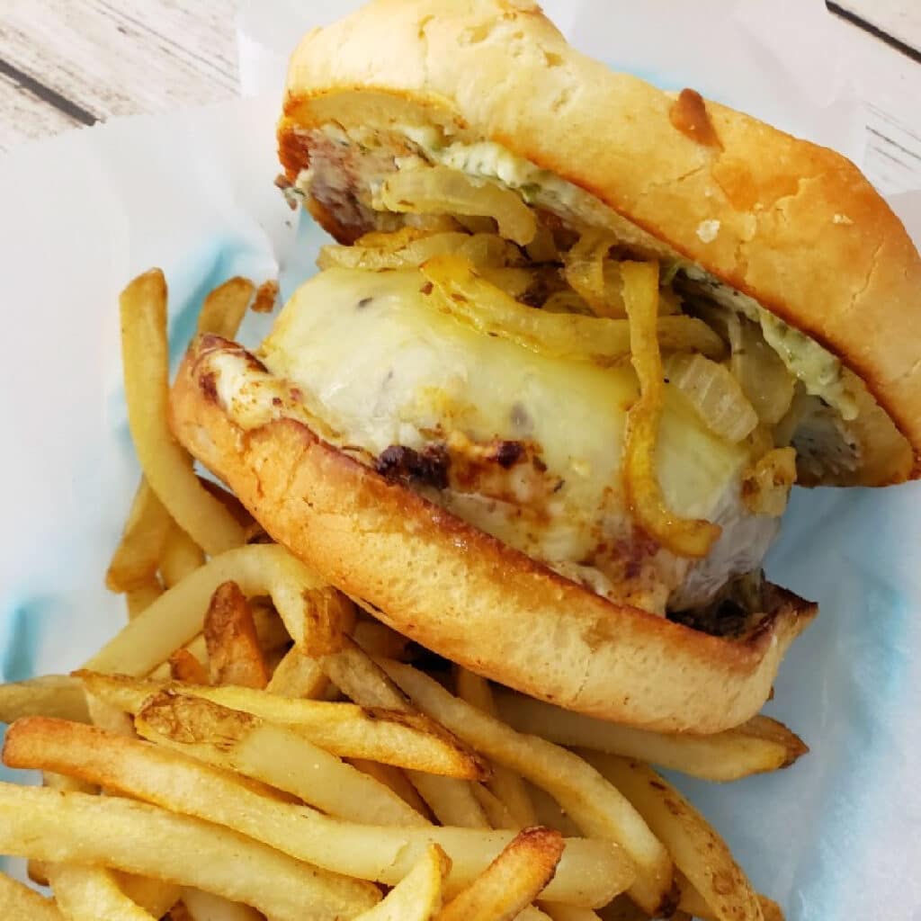 Butter Burger with Cowboy Butter and carmelized onions with french fries.