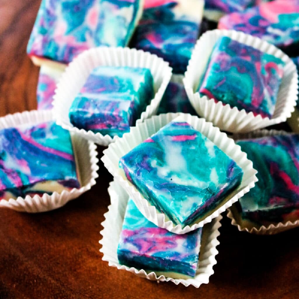 Squares of Cotton Candy Fudge on a platter.