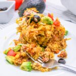 Close up of Cowboy Corn Casserole on a plate with a fork.