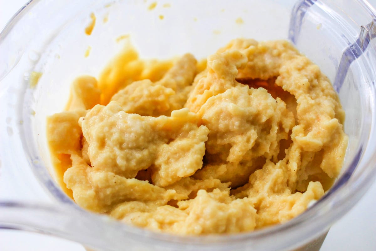 Orange Peach Smoothie mixture in a high powdered blender.