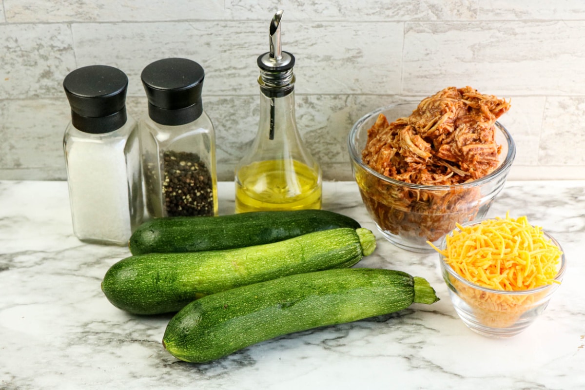 Pulled Pork Stuffed Zucchini Boats Ingredients on a countertop.