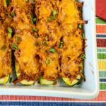 Pulled Pork Stuffed Zucchini in a casserole dish.