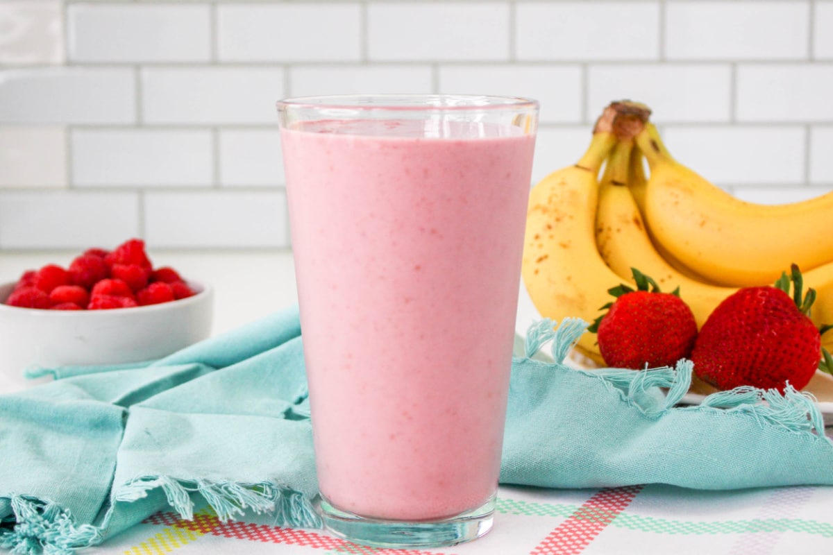 Strawberry Raspberry Banana Smoothie in a tall glass.