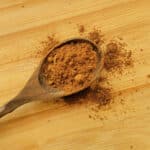 Apple Pie Spice Mix and a small wooden spoon.