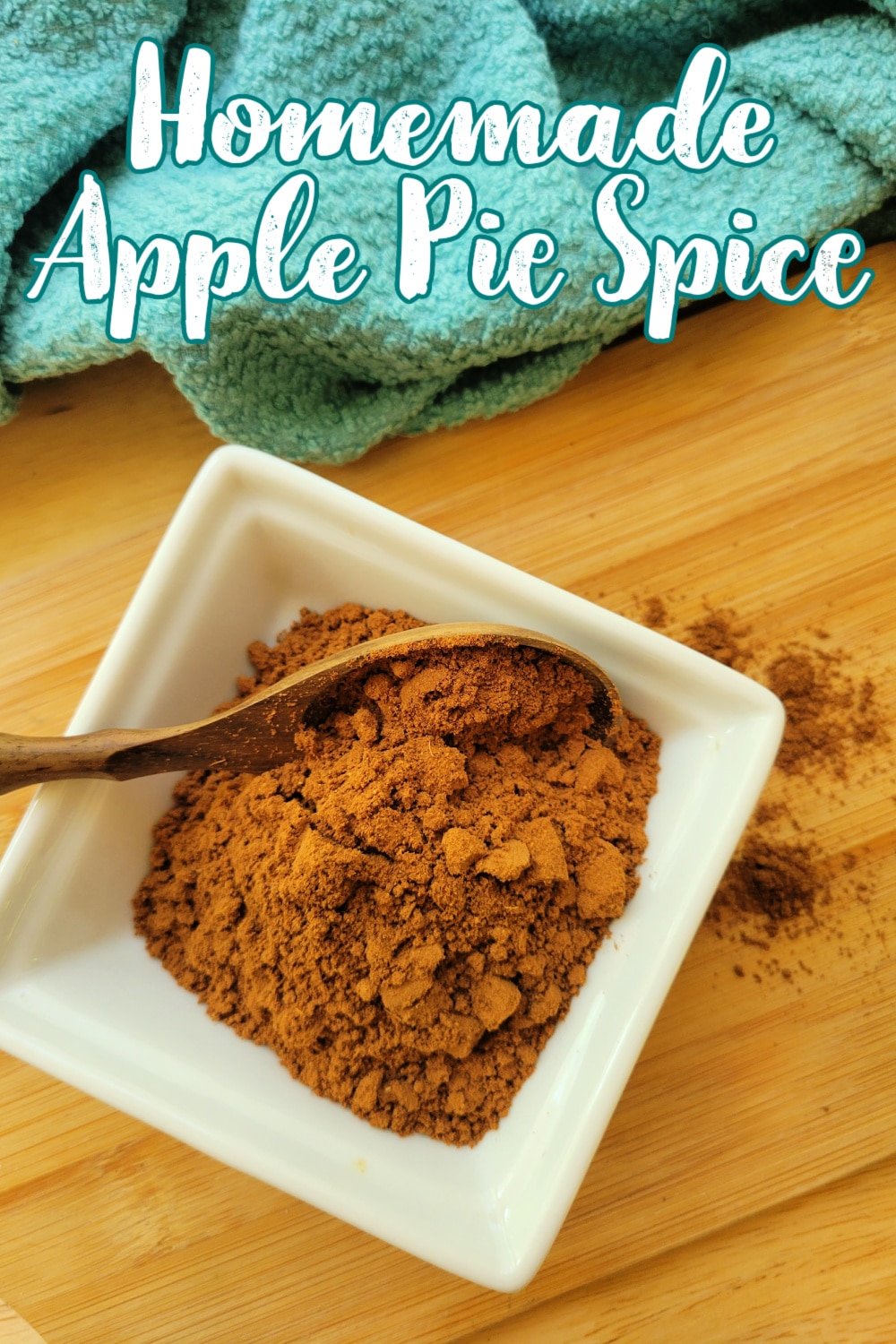 Homemade apple pie spice recipe: a small bowl with a wooden spoon.