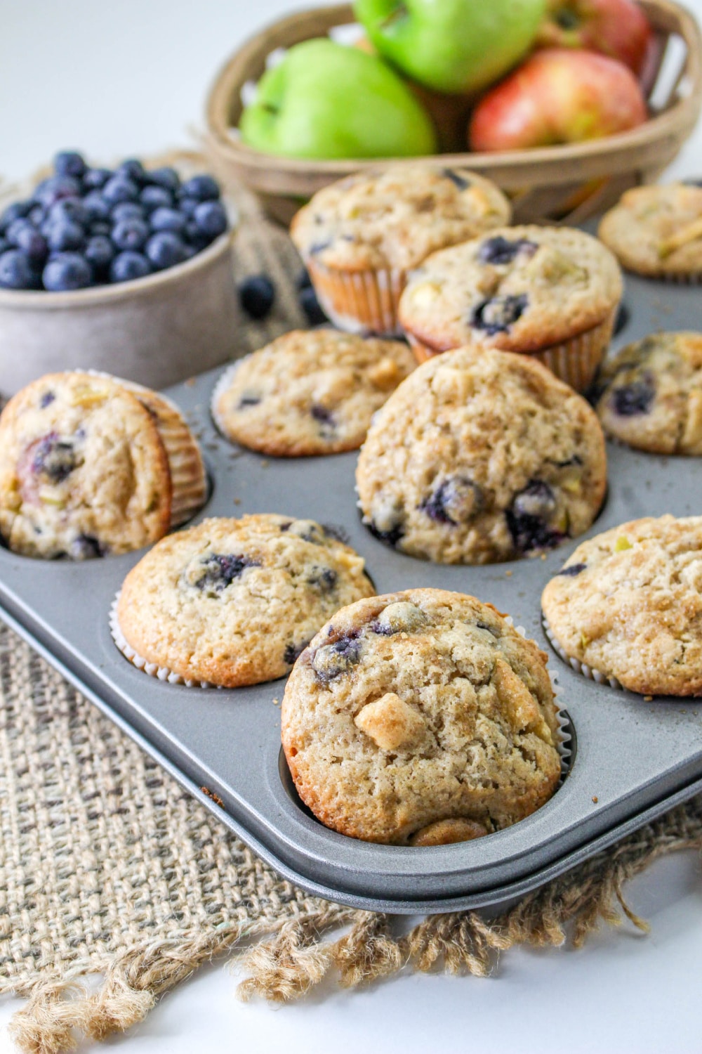 Blueberry and Apple Muffins with a muffin pan.