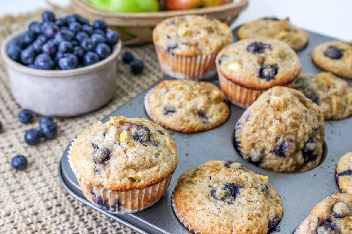 Apple and Blueberry Muffins with a muffin pan.