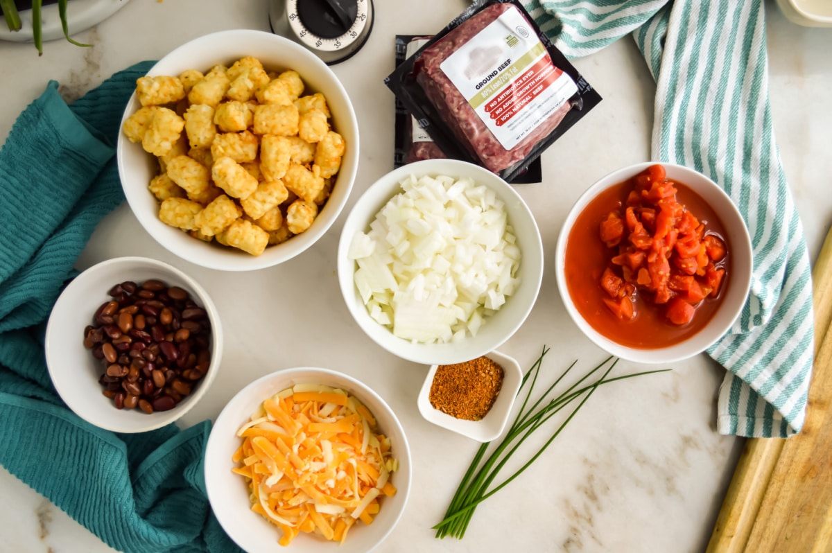 Chili Cheese Tater Tot Casserole Ingredients on a countertop.