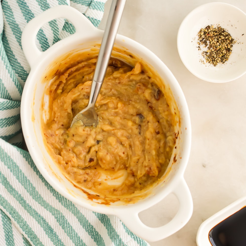 Roasted Garlic Paste in a bowl with a fork.