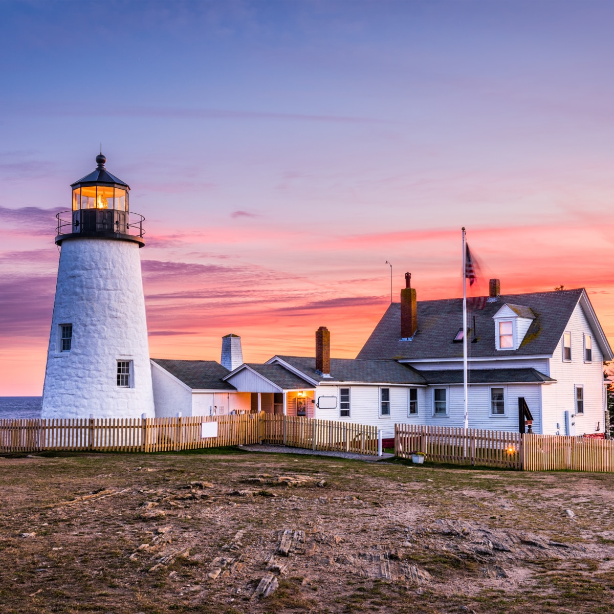 Pemaquid Point Lighthouse in Bristol, Maine, USA at sunset.