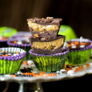 Homemade peanut butter cups for Halloween stacked on top of one another.
