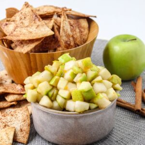 Fresh Apple Salsa in a small bowl with cinnamon chips.
