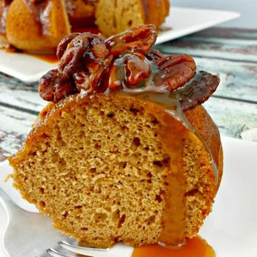 Close up of Apple Spiced Bundt Cake with caramel and pecans.