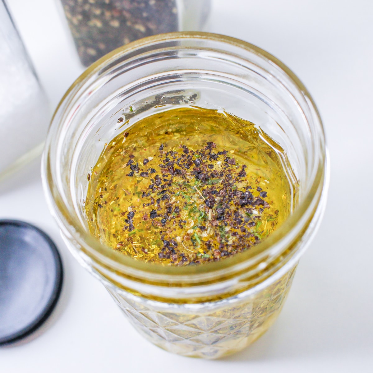 How to make lemon mustard vinaigrette in a mason jar.
